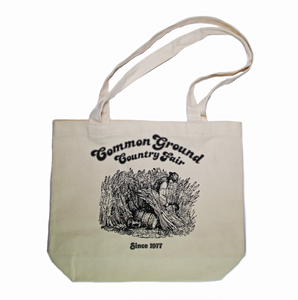 1980 Common Ground Country Fair reprint of small organic cotton tote bag. Farmer cutting wheat. Color white